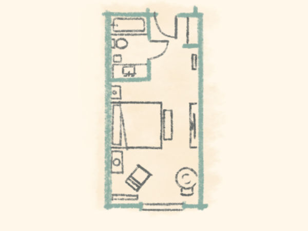 A compact apartment layout with a bed, desk, small kitchen, bathroom, and seating area in a narrow rectangular floor plan.