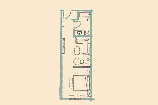 This image shows a simple floor plan layout of a small apartment or hotel room, including a bed, seating area, and bathroom.