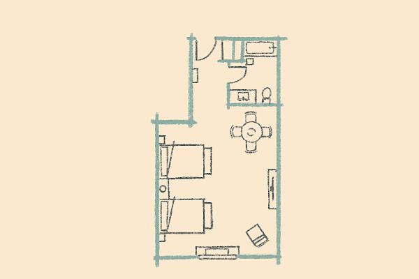 A simple floor plan with two beds, a bathroom, sitting area, and entrance. Furniture and fixtures are minimally depicted.