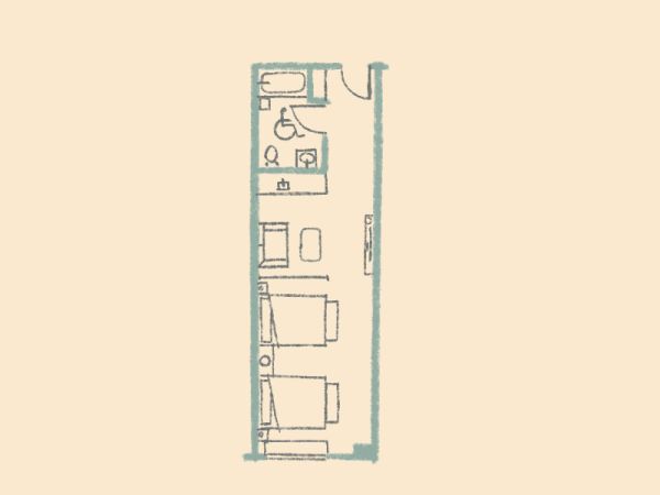 This is a simple floor plan layout with a bathroom, a kitchenette, and a living area, possibly for a small apartment or room.