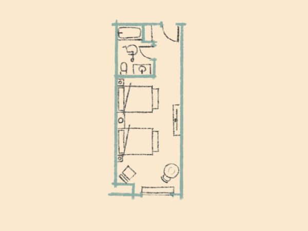 This image shows a basic floor plan layout with two beds, a bathroom, and a small sitting area.