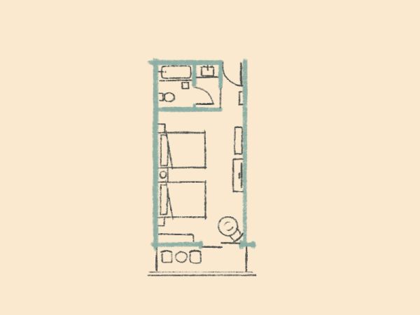 This image shows a simple floor plan with a small bathroom, a kitchenette, and a room with two beds.